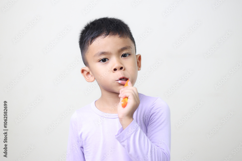 child Asia kid boy brushing teeth isolated on white backgroud. child Asia kid boy brushing teeth isolated on white backgroud.