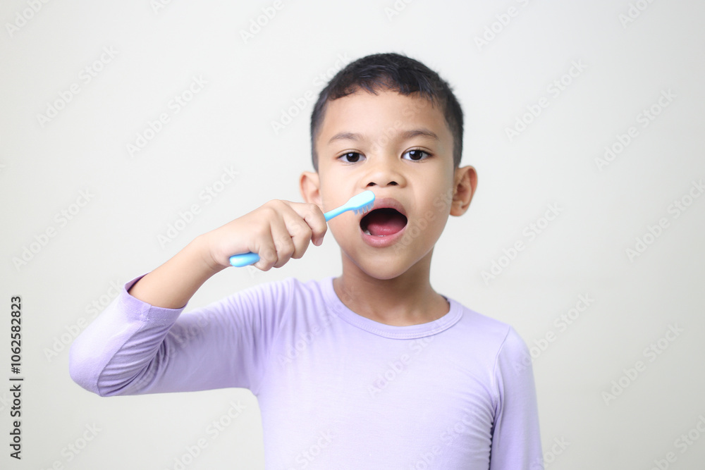 child Asia kid boy brushing teeth isolated on white backgroud. child Asia kid boy brushing teeth isolated on white backgroud.