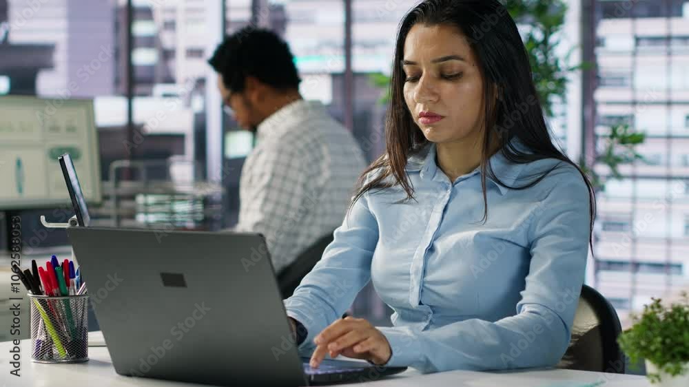 Corporate indian woman experiences business pressure at the office, overwhelmed by administrative tasks and deadlines. Manager with frustration dealing with fatigue and low energy. Camera A. Corporate indian woman experiences business pressure at the office, overwhelmed by administrative tasks and deadlines. Manager with frustration dealing with fatigue and low energy. Camera A.