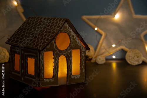 Lighted Cardboard House Gift Christmas idea. Do it yourself instruction eco-friendly decoration. Making handmade presents children's diy projects. Zero waste Holiday family time. Creative activity photo