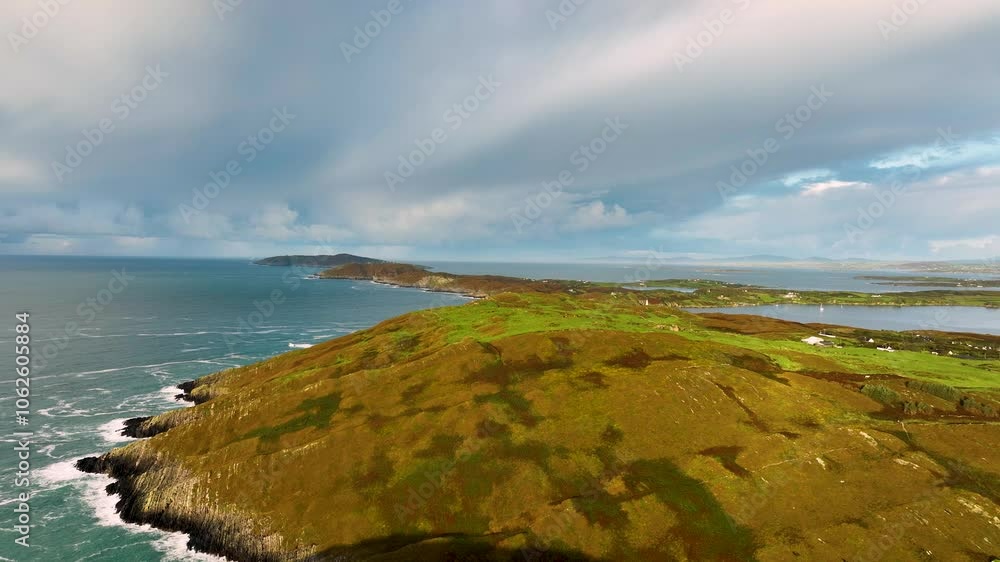 An Aerial View of a Lush Coastal Landscape Showcasing Vibrant Greens and Beautiful Ocean Waves An Aerial View of a Lush Coastal Landscape Showcasing Vibrant Greens and Beautiful Ocean Waves