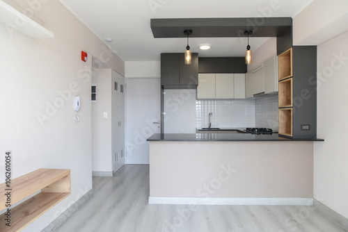 Wallpaper Mural vista de sala de deparatamento con kitchenette estilo americano con mesa de granito y muebles altos y bajos Torontodigital.ca