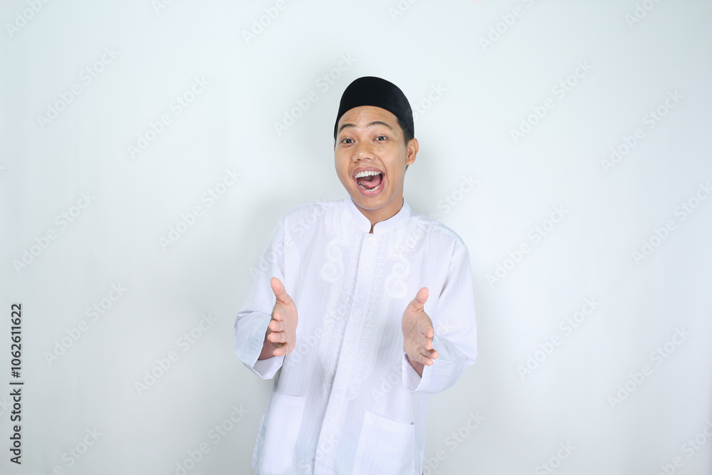 muslim asian man posing holding box and shouting with open mouth isolated on white background muslim asian man posing holding box and shouting with open mouth isolated on white background