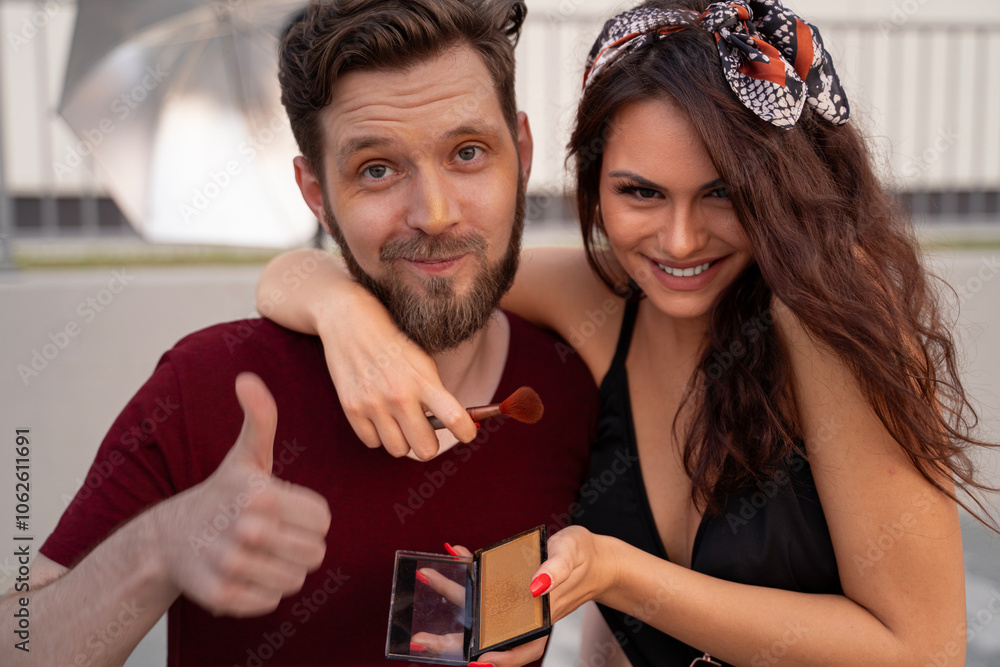 © phoenix021 - Make up on the film set, or photo shoot outdoors, woman makeup artist putting on makeup on male actor. Behind the scenes © phoenix021 - Make up on the film set, or photo shoot outdoors, woman makeup artist putting on makeup on male actor. Behind the scenes