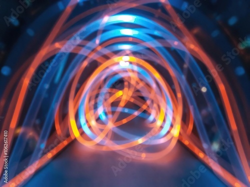 Abstract tunnel composed of intertwining blue and orange light beams, creative, glowing, abstract tunnel