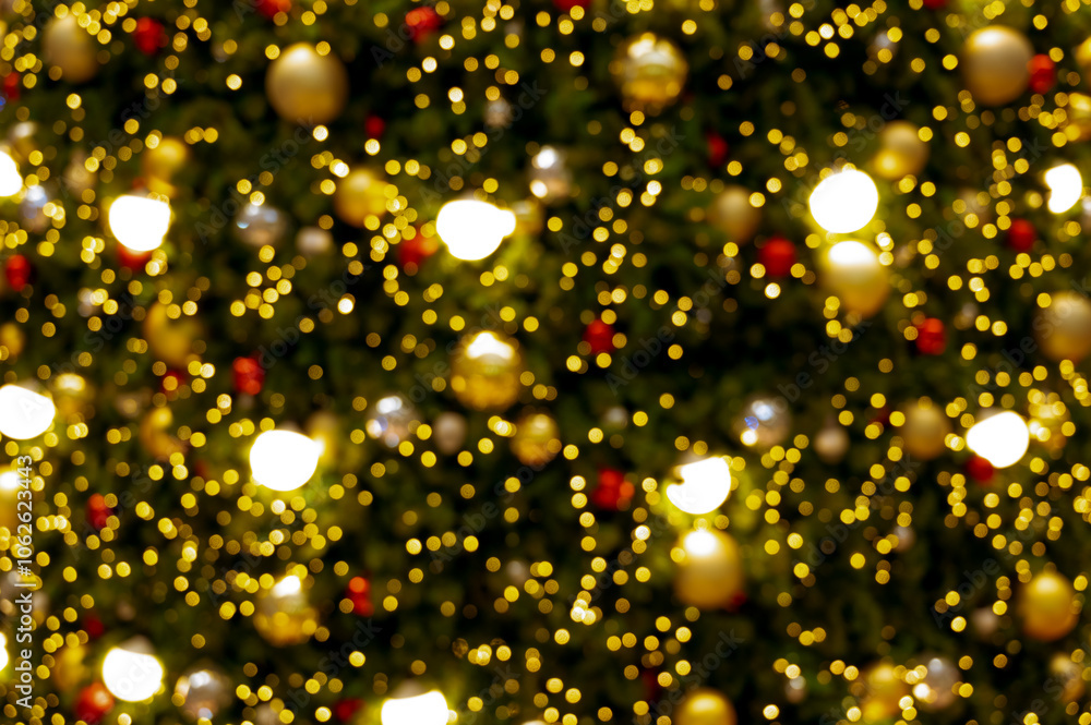 Blurred christmas tree. lights bulb and gold christmas balls ornament decorate christmas tree. Merry Christmas and New Year holiday background. Blurred christmas tree. lights bulb and gold christmas balls ornament decorate christmas tree. Merry Christmas and New Year holiday background.