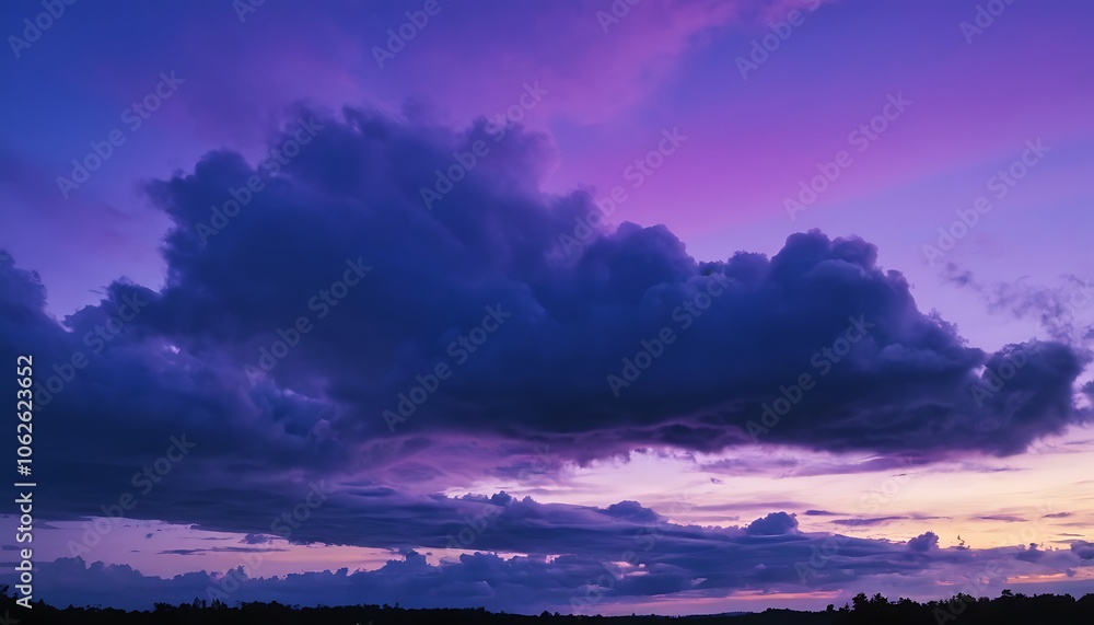 Fototapeta premium A dark and moody purple sky where heavy dark clouds float below a soft violet-hued atmosphere