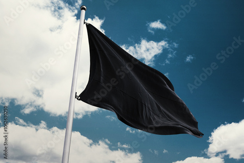 black flag on blue sky background