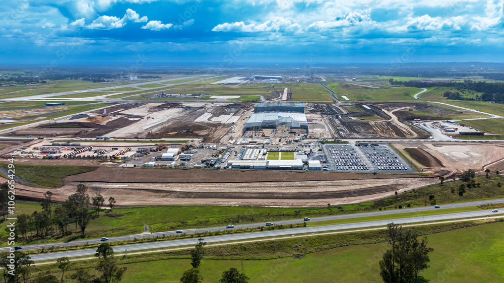 Obraz premium Drone aerial photograph of the new Western Sydney International Airport cargo precinct currently under construction in a large industrial development in greater Sydney, NSW Australia.