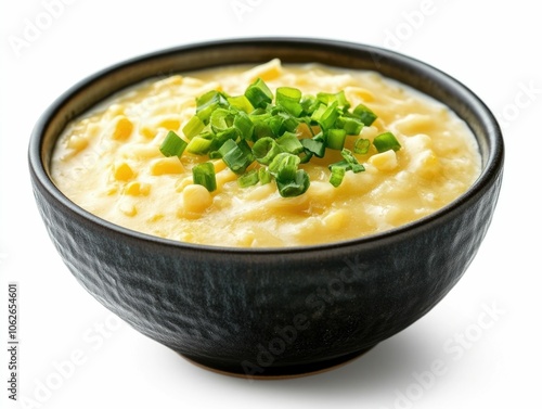 This image showcases a delectable bowl of traditional Thai sweet corn pudding also known as tao suan made with rich coconut milk The dessert has a soft creamy texture and a tempting