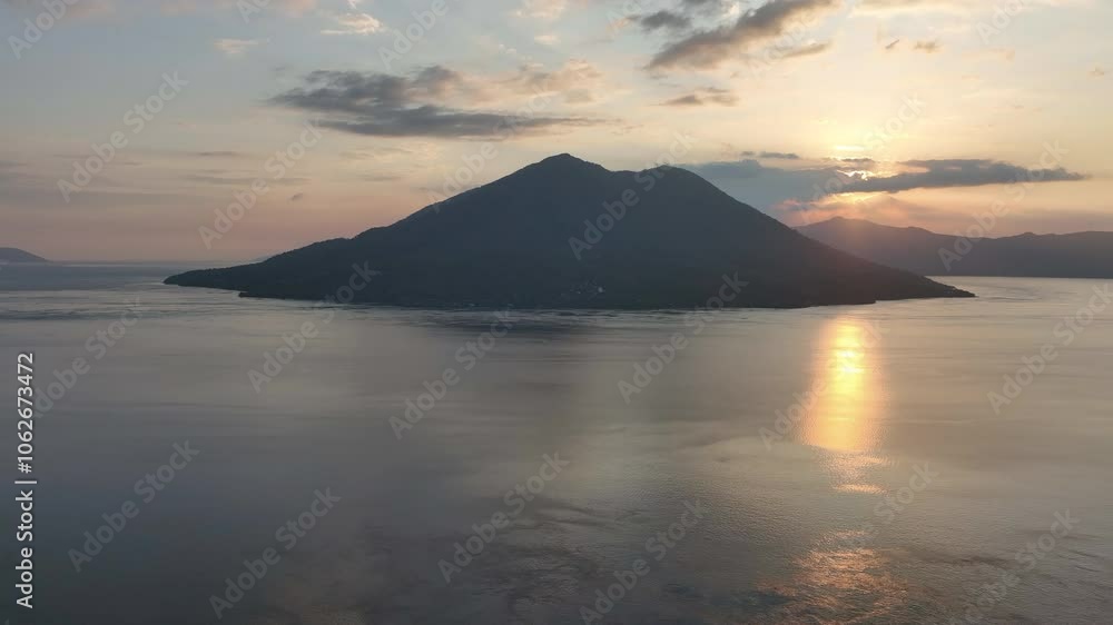 The sun sets over Pulau Pura and the Pantar Strait, separating the islands of Pantar and Alor, Indonesia. This beautiful area, in the Lesser Sunda Islands, harbors extraordinary marine biodiversity. The sun sets over Pulau Pura and the Pantar Strait, separating the islands of Pantar and Alor, Indonesia. This beautiful area, in the Lesser Sunda Islands, harbors extraordinary marine biodiversity.