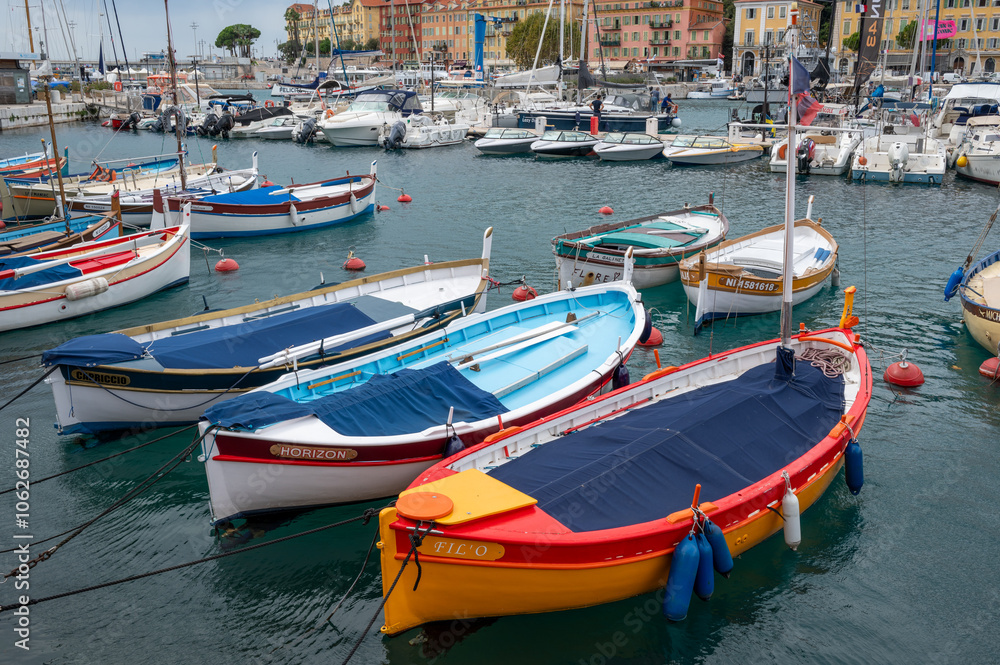Traditional colorful fishing boats, called pointu in French. in Nice Port, Nice, France on sunny summer day. Traditional colorful fishing boats, called pointu in French. in Nice Port, Nice, France on sunny summer day.