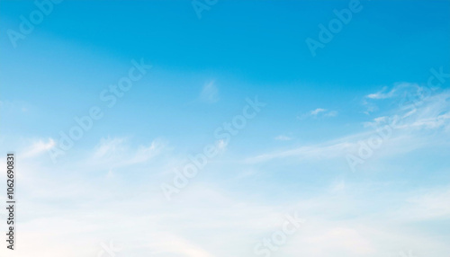 Serene Azure Sky: Wispy Clouds Drifting Across a Peaceful Blue Canvas.