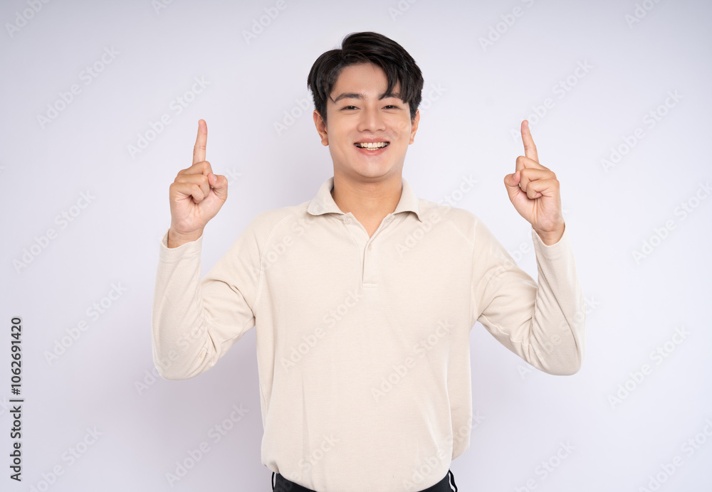 Portrait of young asian businessman wearing sweater and posing on white background Portrait of young asian businessman wearing sweater and posing on white background