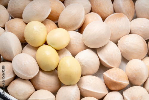 Close up Fresh Ginkgo, Ginkgo seeds in wooden basket on wooden table.