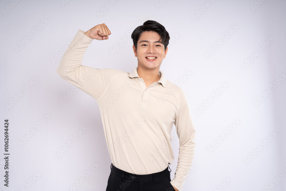 Obraz premium Portrait of young asian businessman wearing sweater and posing on white background