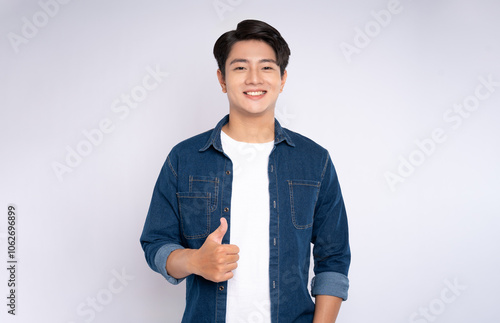 Portrait of young man 
Asian is posing on white background