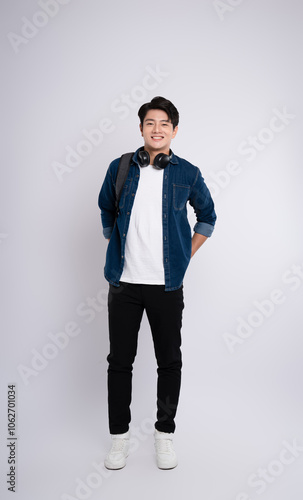 adult, advertisement, asian, background, backpack, casual, cheerful, chinese, confidence, cool, denim jacket, fashion, filipinos, formal, friendly, full, full body, gesture, happiness, happy, headphon photo