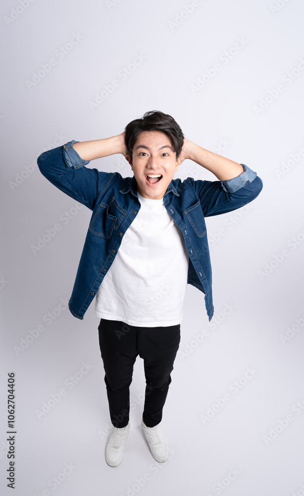 Full body image of a young man posing on a white background Full body image of a young man posing on a white background