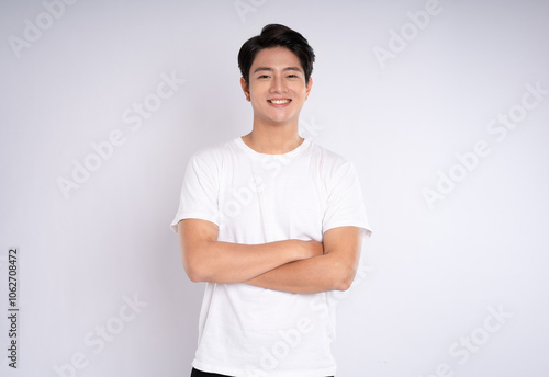 Portrait of an Asian guy posing on a white background