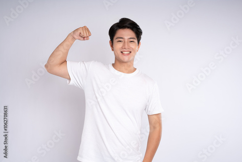 Portrait of an Asian guy posing on a white background