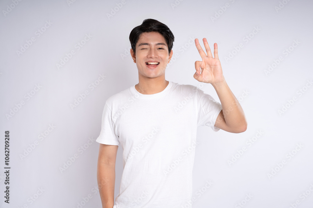 Portrait of an Asian guy posing on a white background