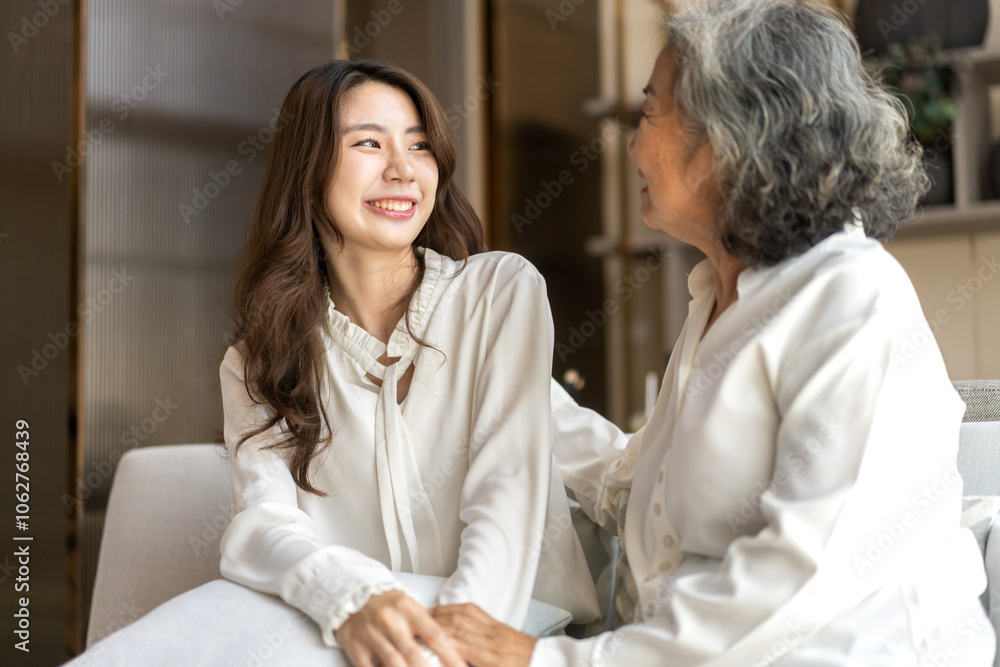 Fototapeta premium Portrait of enjoy happy love asian family senior mature mother and young daughter smiling play laughing and having fun together at home, care, elderly, insurance.happy family and Mother Day concept