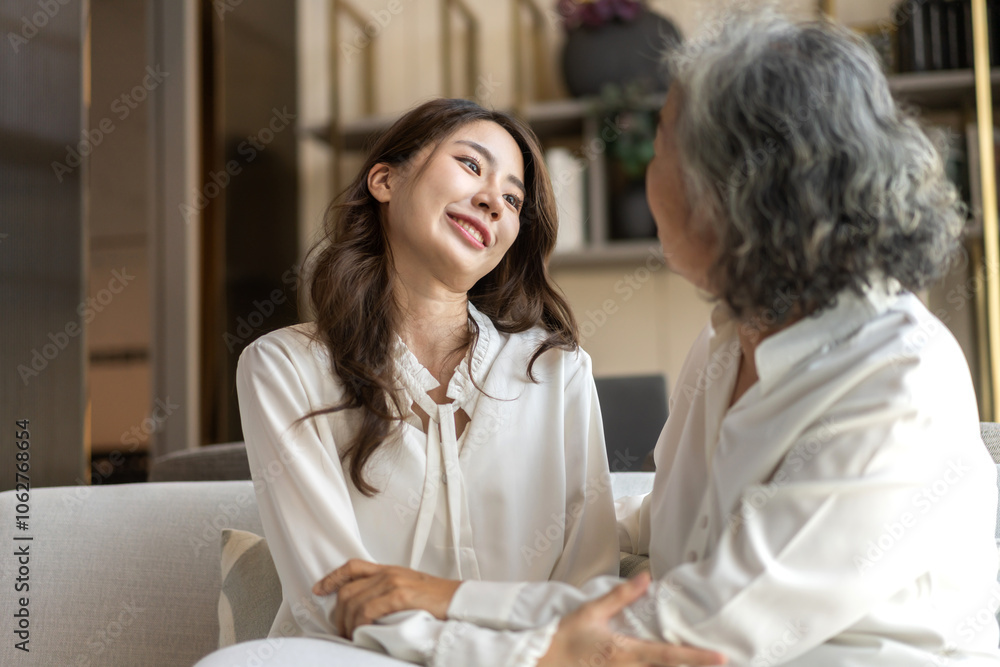 Portrait of enjoy happy love asian family senior mature mother and young daughter smiling play laughing and having fun together at home, care, elderly, insurance.happy family and Mother Day concept Portrait of enjoy happy love asian family senior mature mother and young daughter smiling play laughing and having fun together at home, care, elderly, insurance.happy family and Mother Day concept