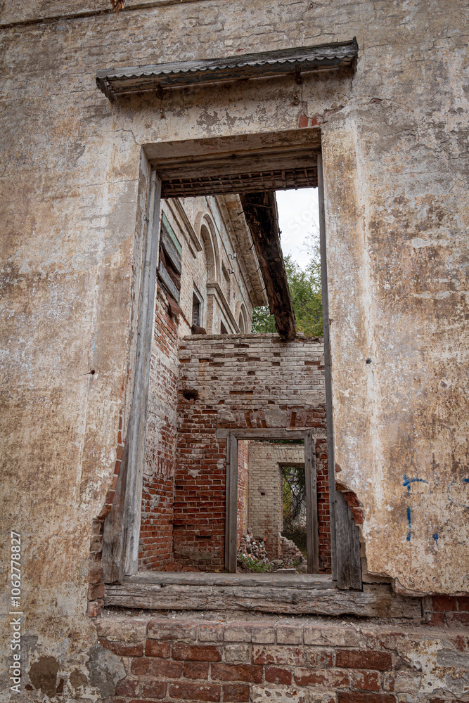 Fototapeta premium Ruins of an old abandoned building. A manor house of the early 19th century.