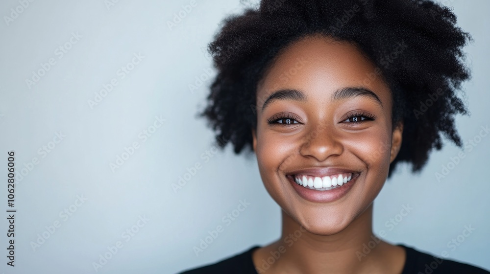 A young African American woman with a bright, genuine smile looks directly at the camera, A young African American woman with a bright, genuine smile looks directly at the camera,