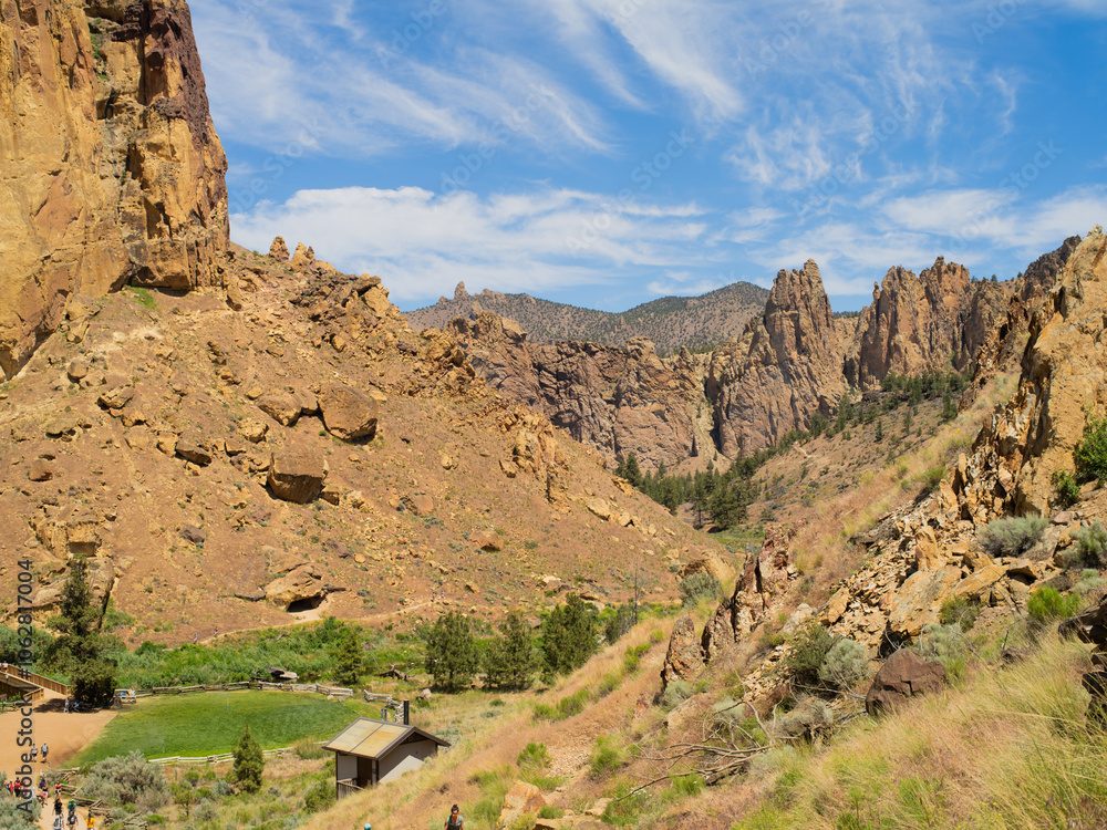 Fototapeta premium A mountain range with a small village in the valley