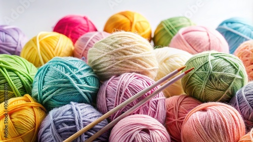 Pastel Yarn Balls and Knitting Needles on White Background photo