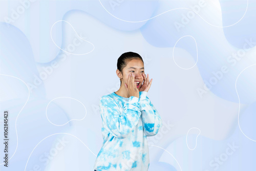 Yougn Asian girl with blue dress points and gives various expression and gestures isolated happy sad photo