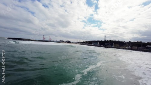 FPV Drone View of Surfable Beach in Pohang, South Korea photo