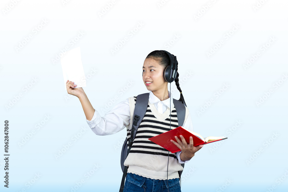 High School Female student with headphones and schoool bag back to university concept after holiday High School Female student with headphones and schoool bag back to university concept after holiday
