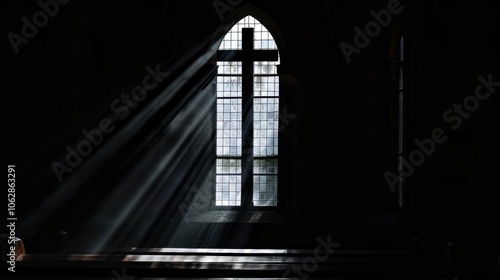 Dark silhouette of a church window illuminating the beauty of Christian faith photo