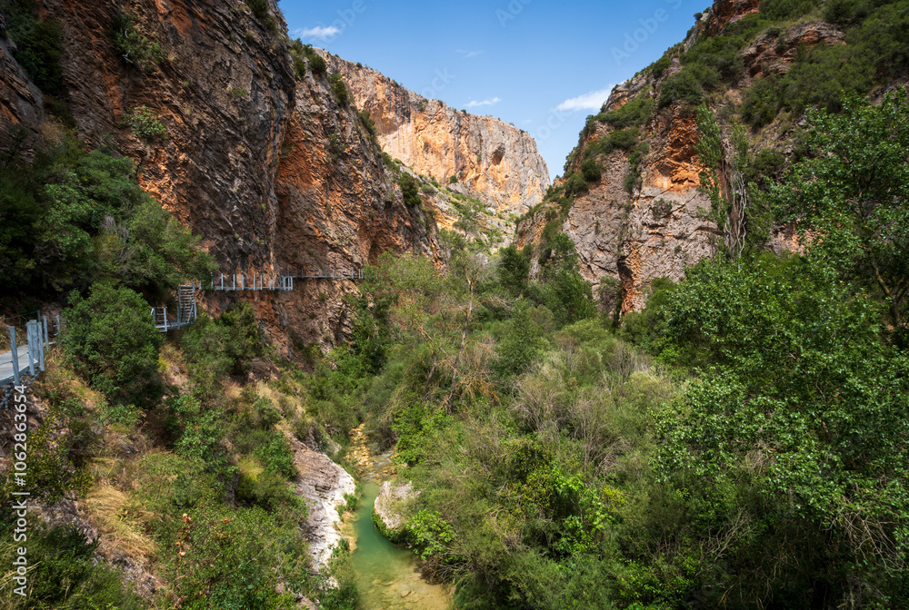 Pasarelas del Vero, walkways and footbridges along a scenic gorge with turquoise water in Alquézar, Huesca, Spain Pasarelas del Vero, walkways and footbridges along a scenic gorge with turquoise water in Alquézar, Huesca, Spain