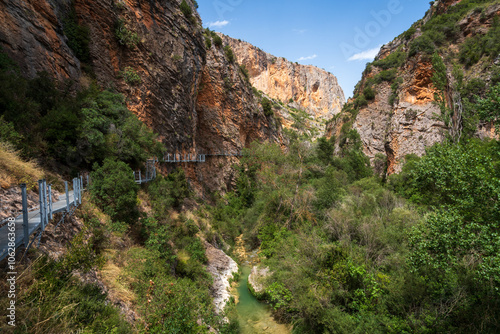 Pasarelas del Vero, walkways and footbridges along a scenic gorge with turquoise water in Alquézar, Huesca, Spain