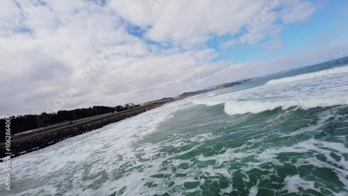 FPV Drone View of Surfable Beach in Pohang, South Korea photo