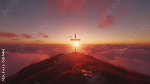 Silhouette of a cross at sunset on a hill with the sky glowing in the background