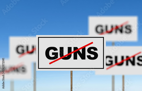 Protesters holding anti-gun signs promoting gun control photo