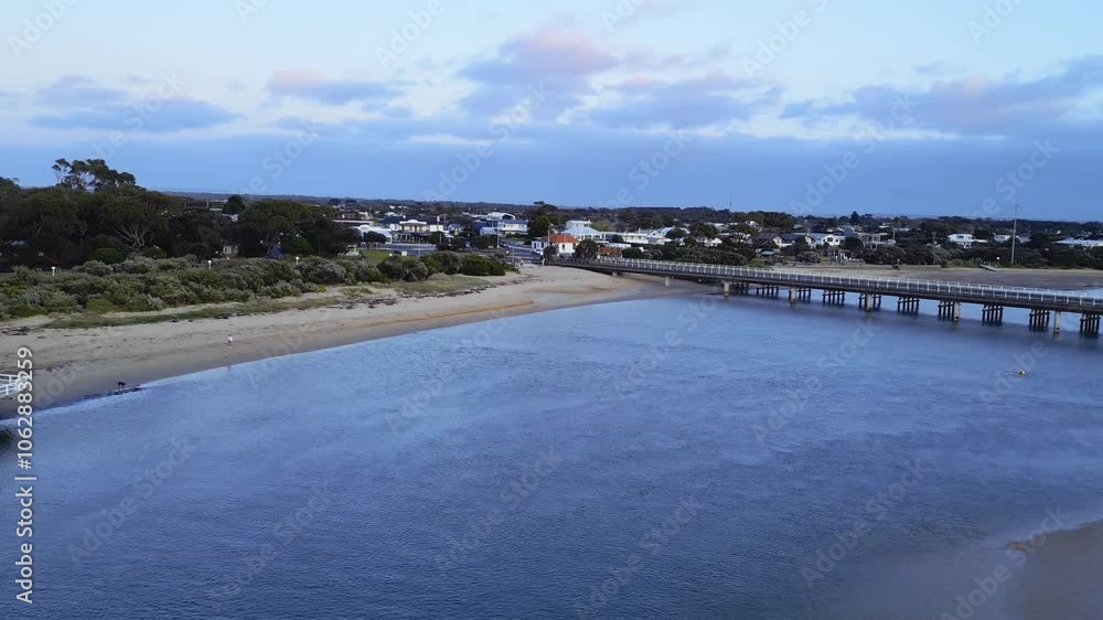 Aerial Barwon Heads Bridge and townscape captured from above at dusk
