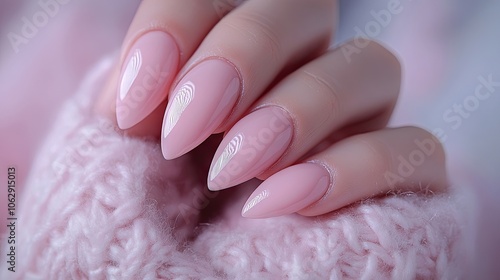 Elegant almond-shaped nails adorned in a soft pastel pink hue create a stunning look. These beautiful almond nails offer a perfect blend of style and grace, with ample photo space. photo