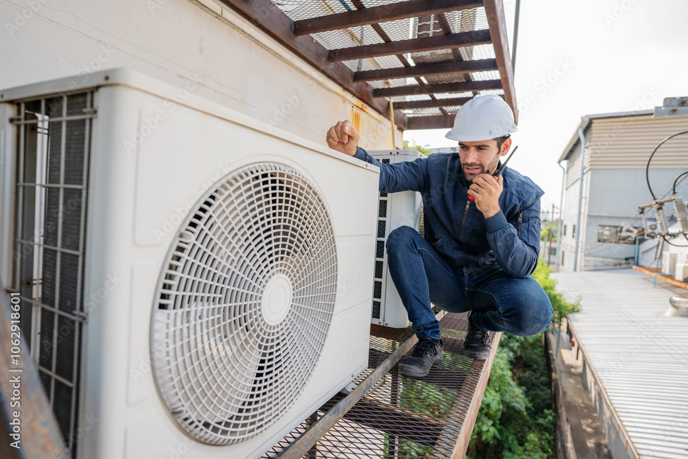 Air conditioner technician checking air conditioner operation. Air conditioner technician checking air conditioner operation.