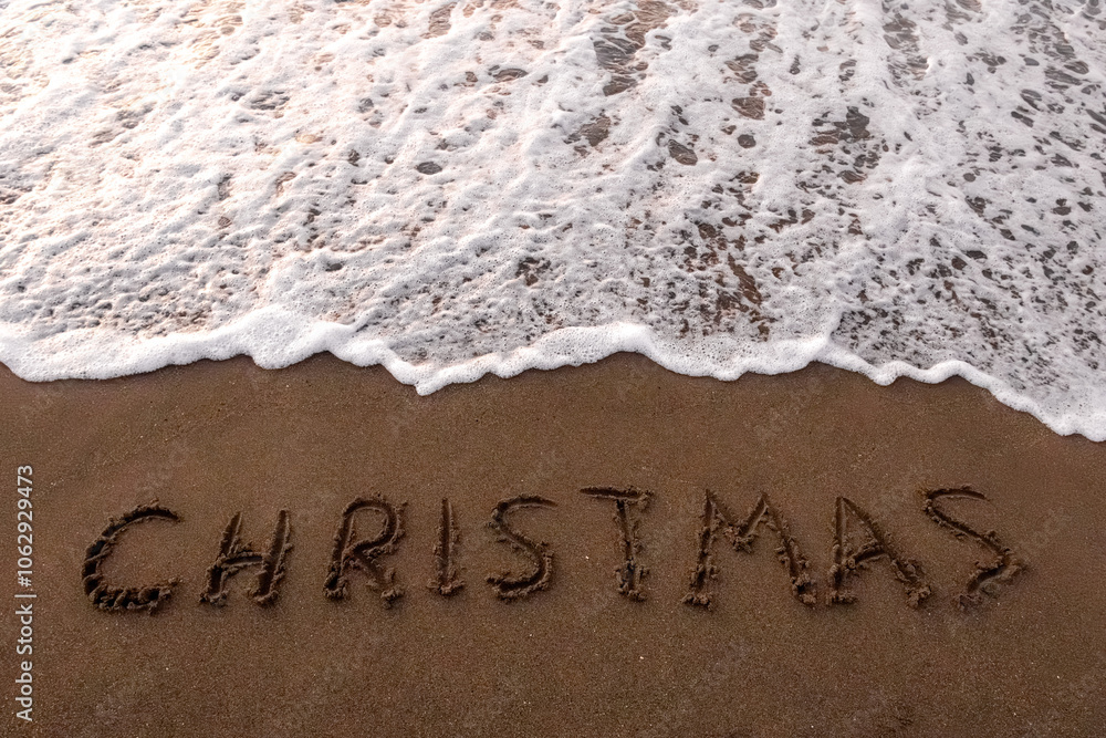 Fototapeta premium inscription mary christmas on the seashore