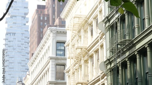 New York City Manhattan Soho fashion district near Broadway street. USA urban building facade, old classic american architecture. Shopping in NYC, United States. Business and residential real estate.