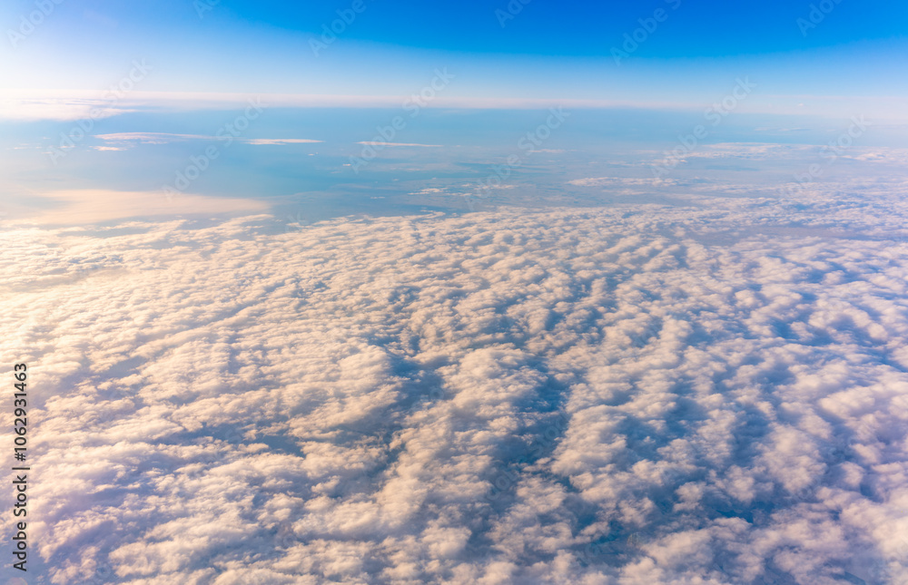 Beautiful orange and pink sunrise over the clouds, view from the plane. Beautiful orange and pink sunrise over the clouds, view from the plane.