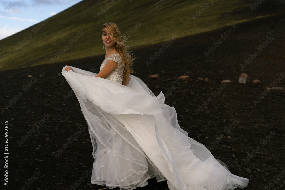 © Cavan Images - Bride in a wedding dress in the mountains of Iceland © Cavan Images - Bride in a wedding dress in the mountains of Iceland