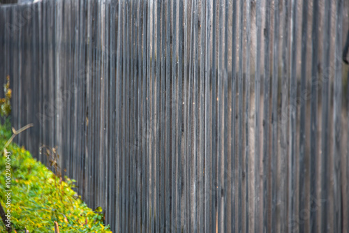 Wooden fence made of grey picket fence.