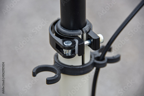 Clamp for adjusting the height of the handlebars on a scooter with holders.